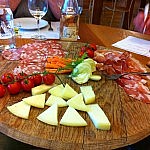 A plate of cheese and cold meats