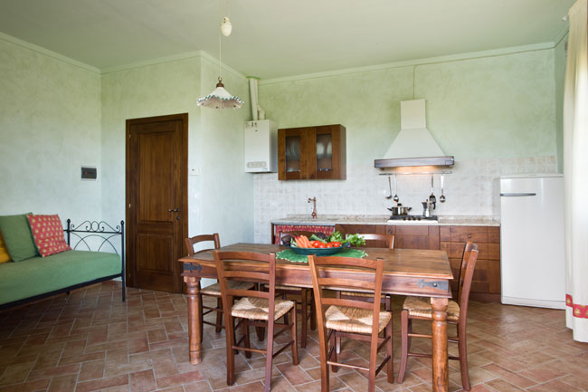 Kitchen and dining room in Tuscan apartment