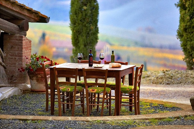 Wine sampling in front of panoramic vineyard