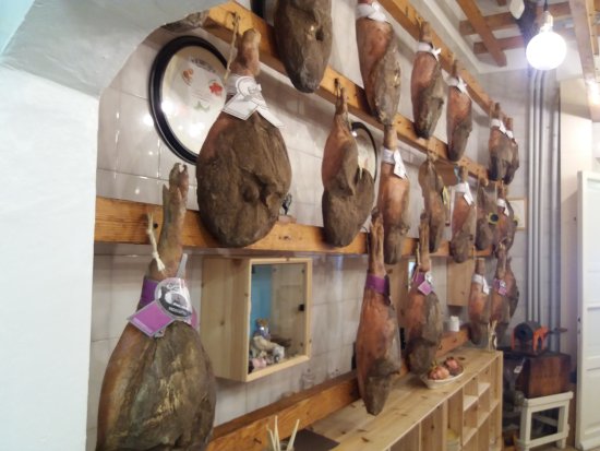 Prosciutto hanging in the butcher's shop of San Miniato