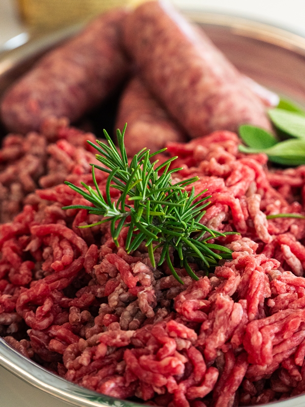 Beef meat, pork sausages and rosemary