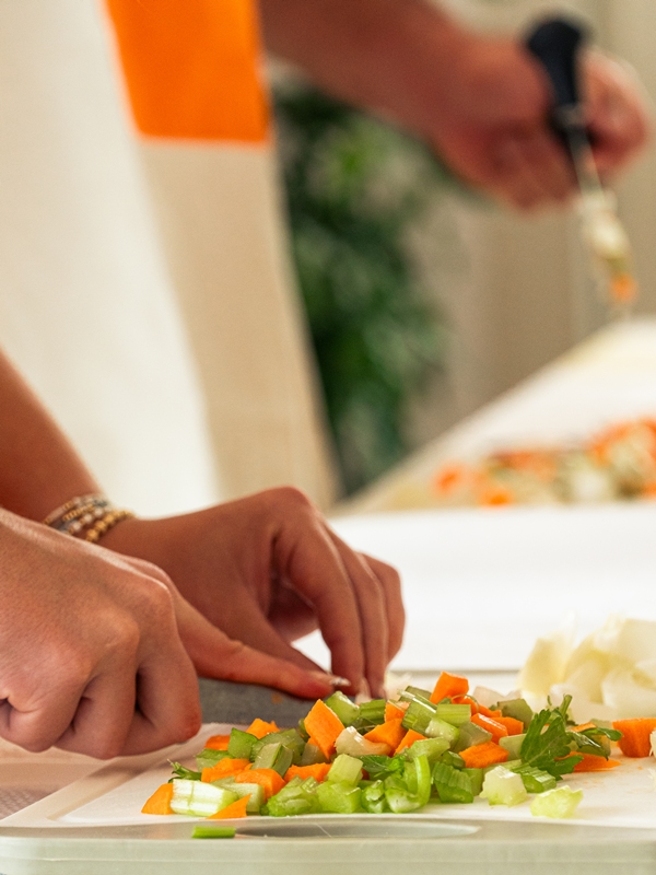 cutting vegetables during our cooking class