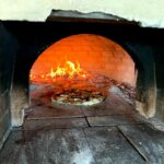 Pizza with zucchini and zucchini flowers
