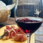 Tasting of red wine with local prosciutto