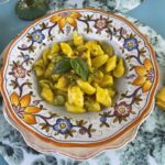 Tasting of potato gnocchi with vegetarian sauce
